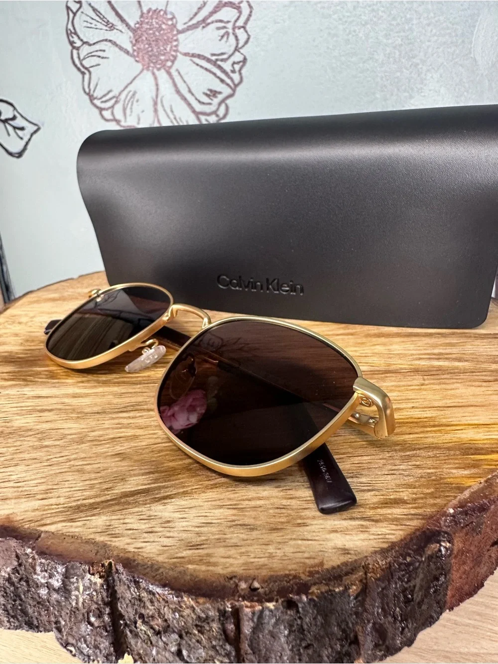 Calvin Klein Gold Frame Sunglasses with Dark Lenses